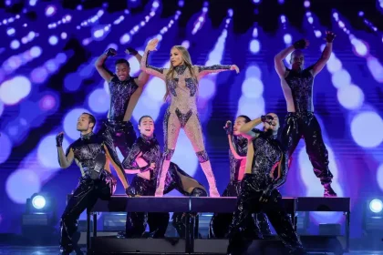 Jennifer Lopez Stays Cool Onstage as Cricket Climbs Her Dress During Kazakhstan Show